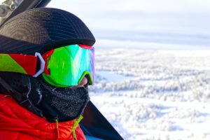 young boy in alps. Teenager in ski goggles at the ski resort. reflection in ski goggles