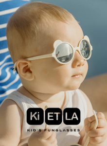 photo d'un enfant portant des lunettes de soleil, disponible en plusieurs coloris, tendant, flexible de la marque Ki et Là