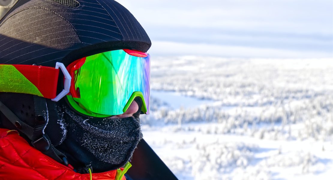 young boy in alps. Teenager in ski goggles at the ski resort. reflection in ski goggles